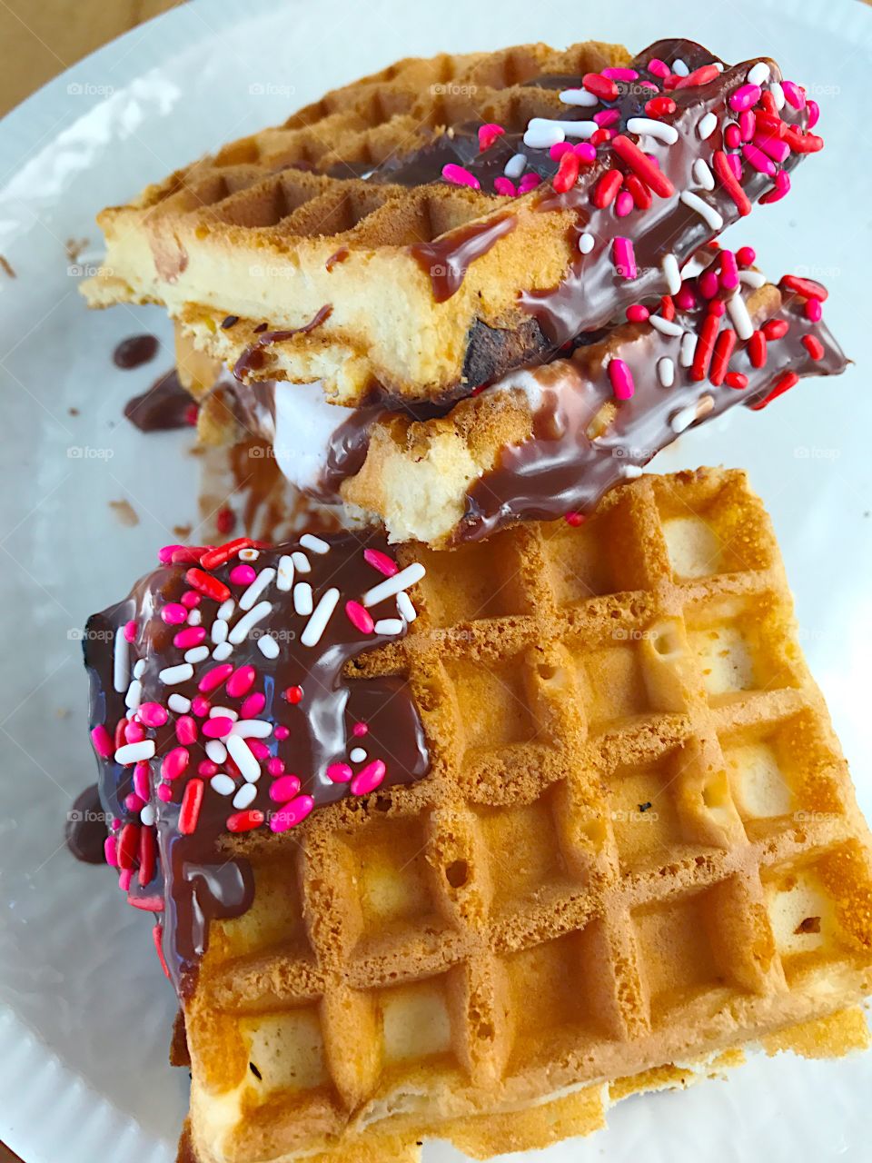 Waffle sandwiches with ice cream and chocolate 