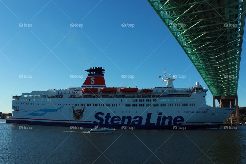 A ferry approaching a bridge