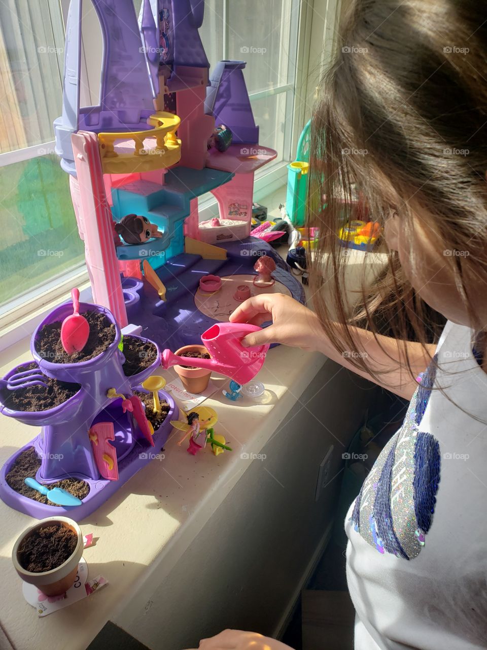 watering the fairy garden