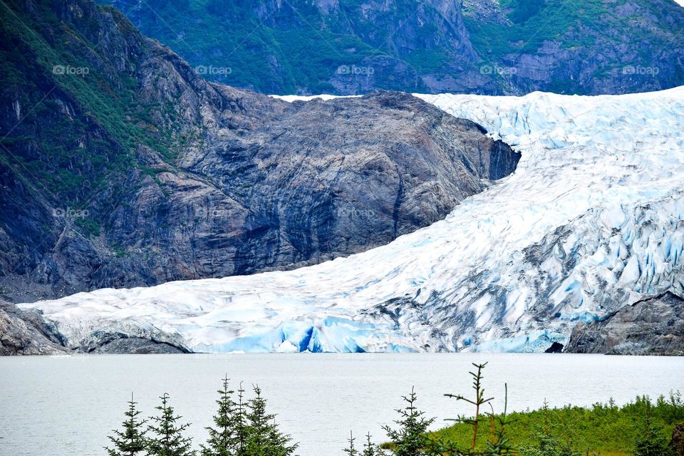 Mendenhall Glacier in Alaska sparkles with blue ice as a result of the thaw and freeze process