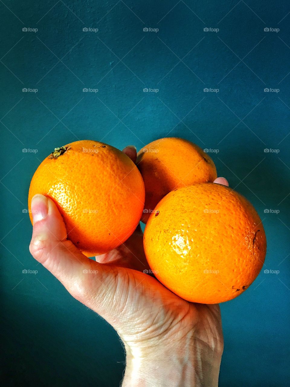 Holding oranges