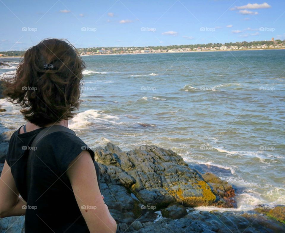 Woman  next  to  ocean 