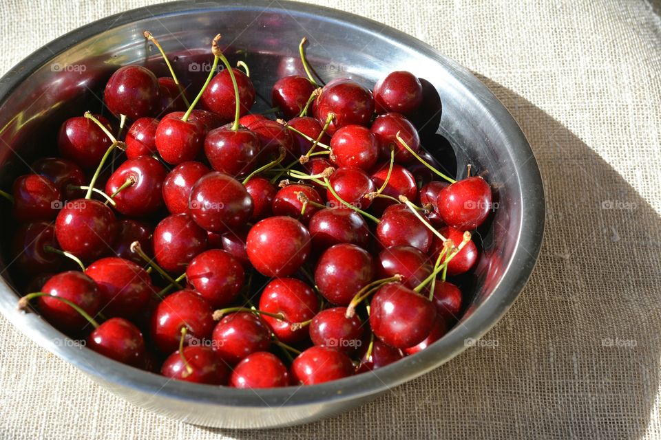 red cherry summer food on a plate natural background