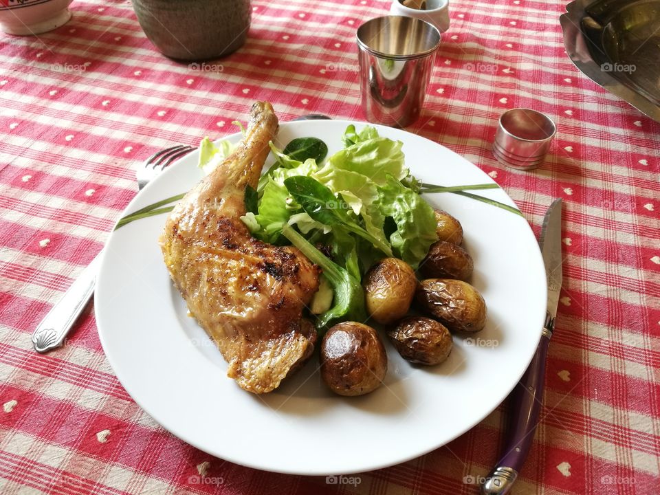 Salad, potatoes and roast chicken
