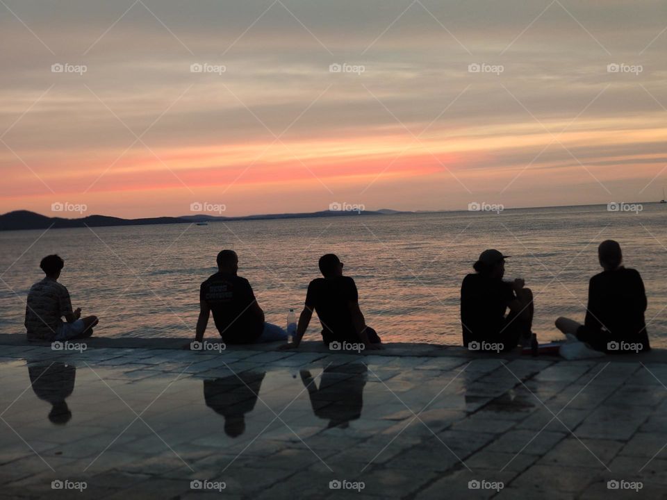 Romantic watch of the sunset on the dock