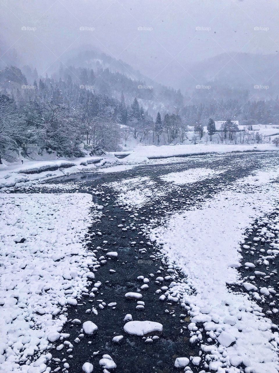 A breathtaking lookout of the pebled valley in a snowy shirakawago, japan. Pleasingly aesthetic