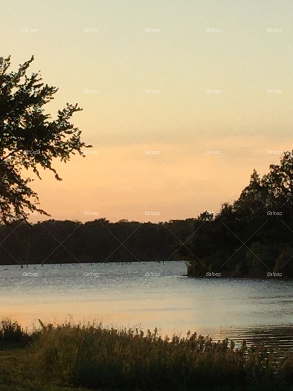 Evening falling upon a Texas lake in summertime 