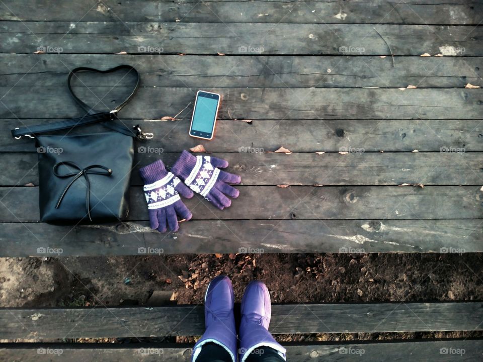 boots and female objects on a wooden table