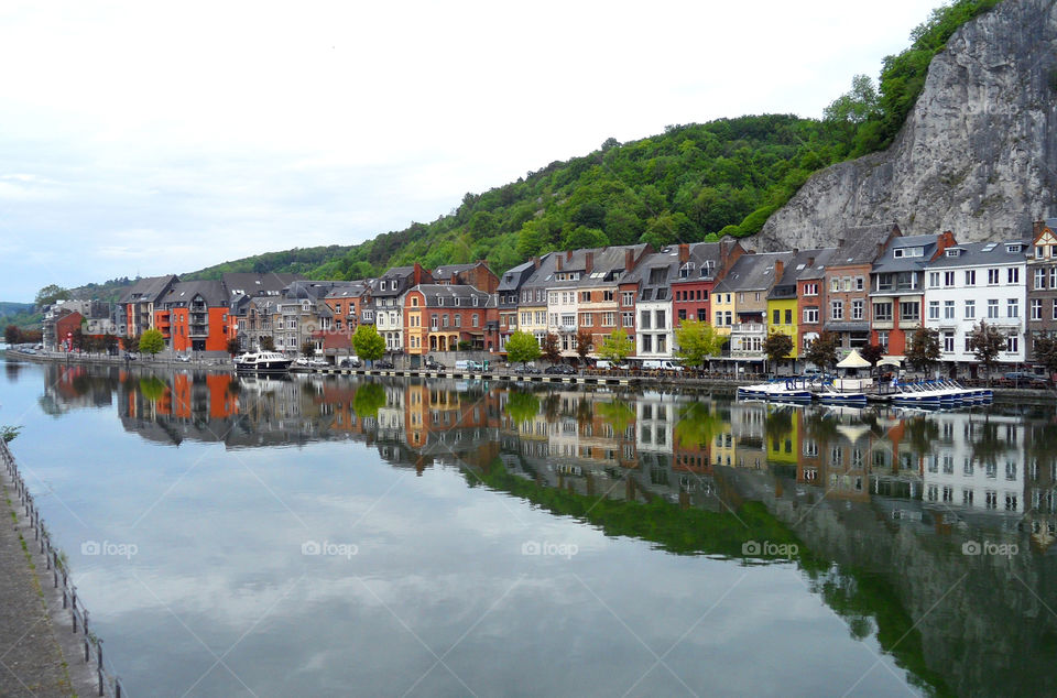 Reflection of Colorful Architectures on the River in Dinant, Belgium