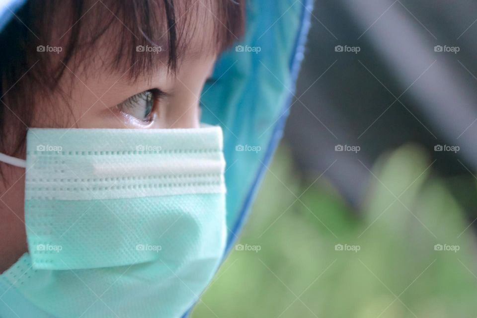 a little boy wearing a mask