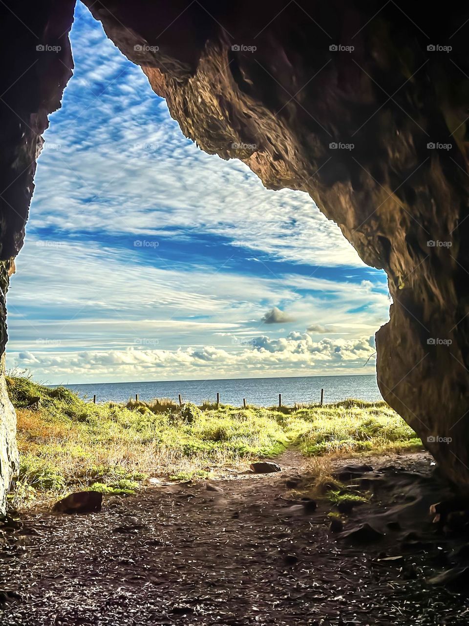  View from a cave looking out onto the sea