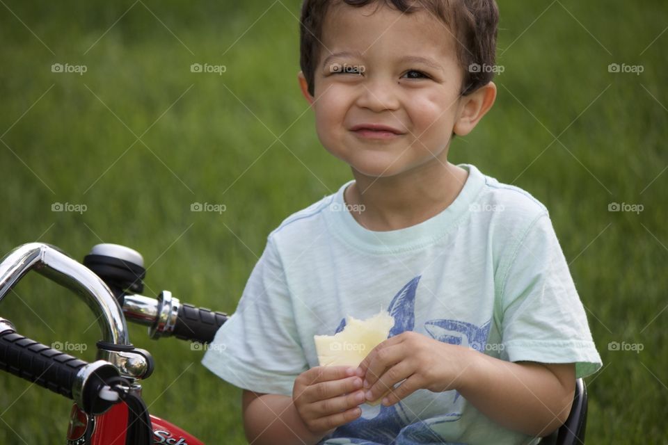 Loving his pineapple slice