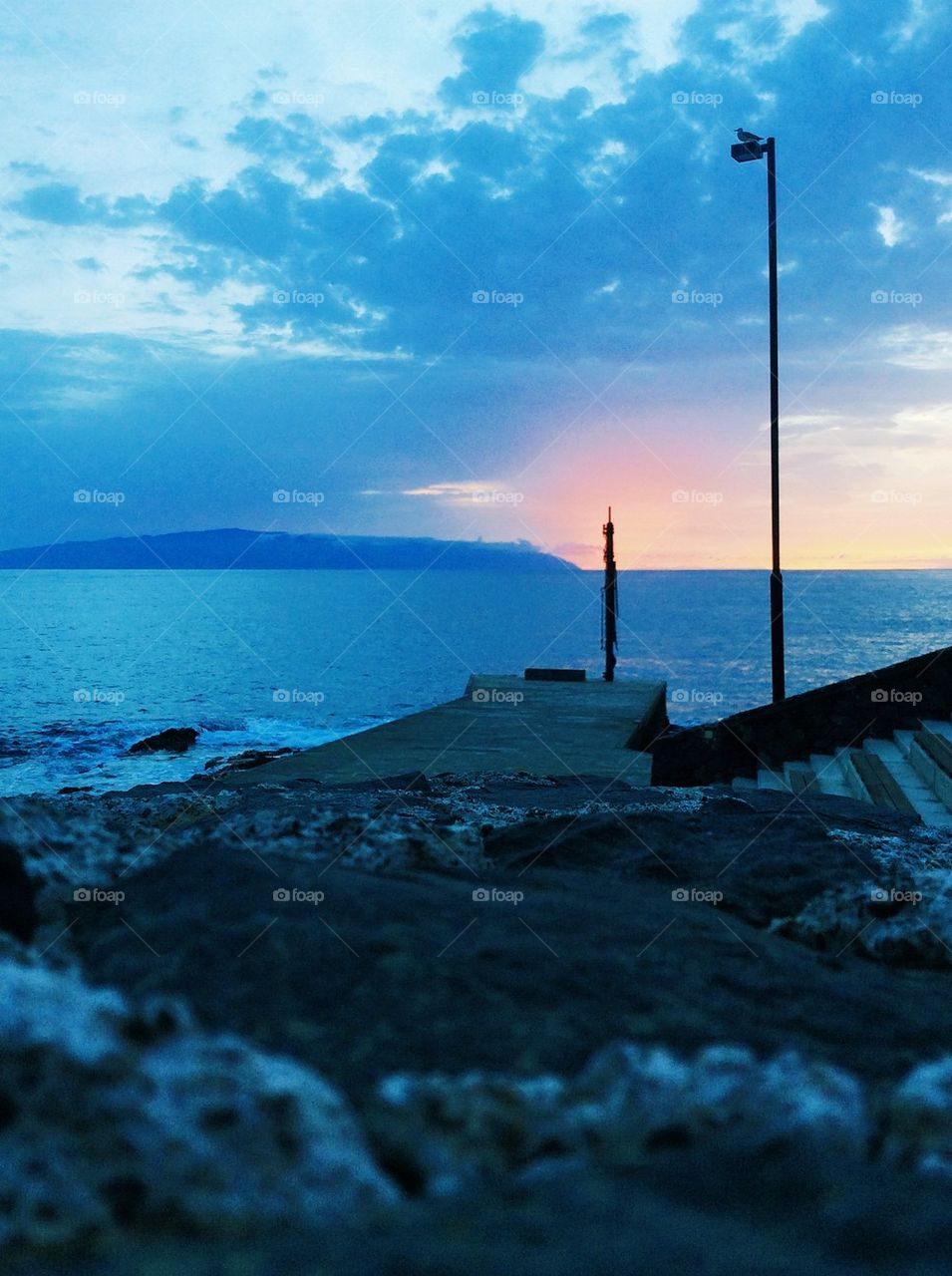 Late sunset on the ocean shore