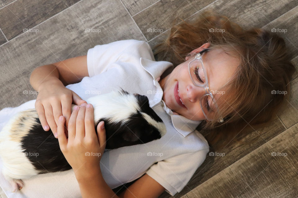 Child and guinea pig
