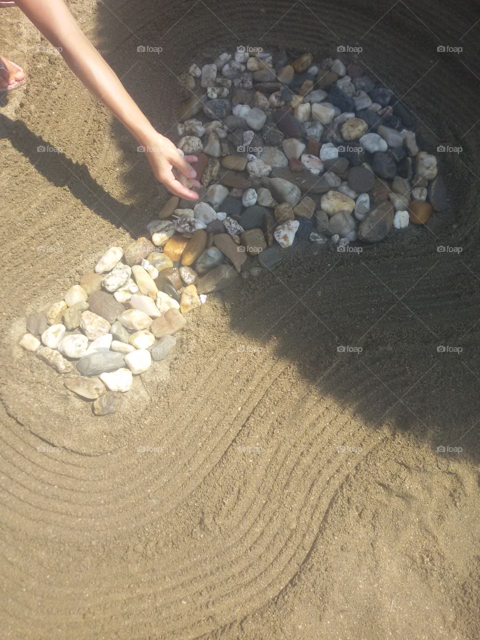 Tree made of rocks on beach