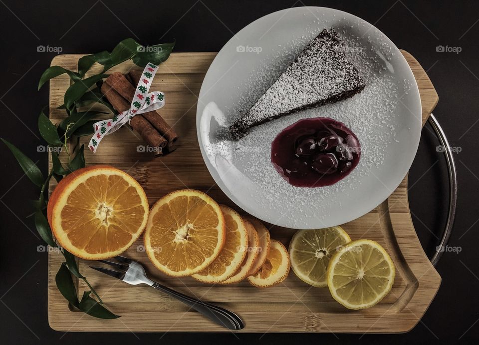 Elevated view of dessert with orange fruit and cinnamon