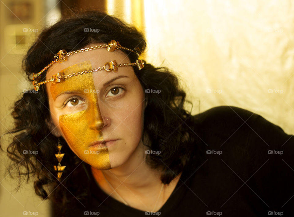 Golden make-up on the woman's face