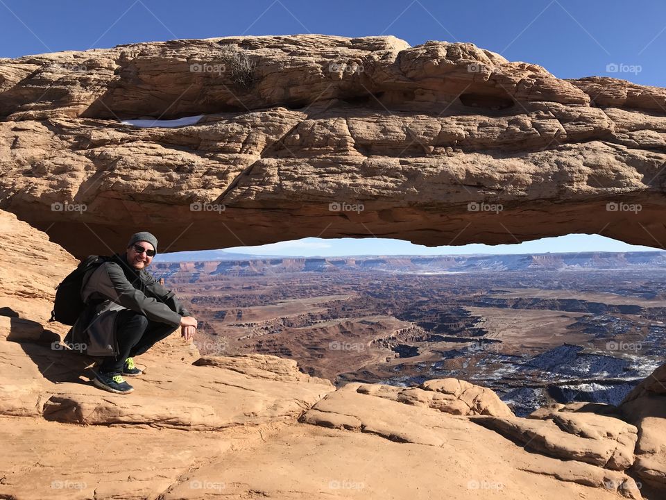 Man enjoying the view at arch canyonlands