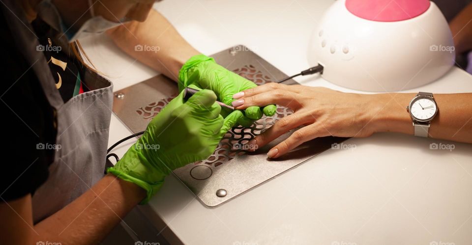 woman doing manicure