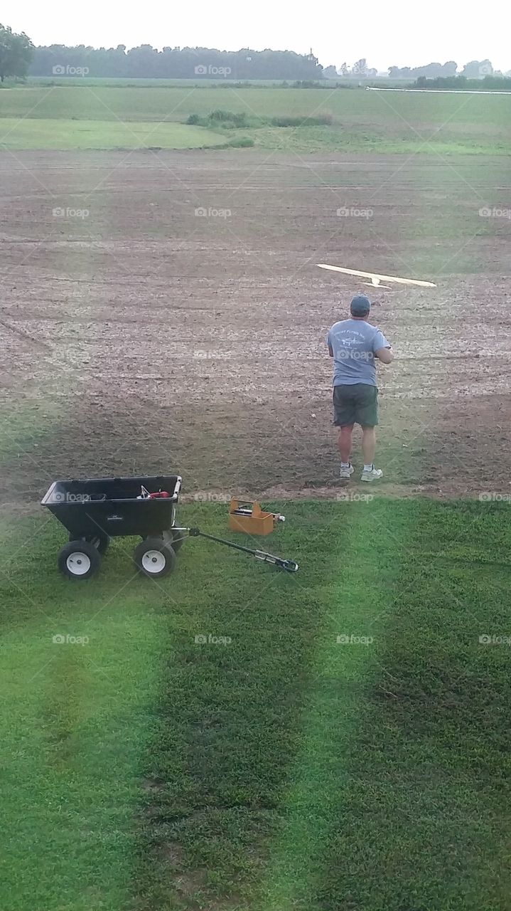 Remote control airplane. My hubby flying his models