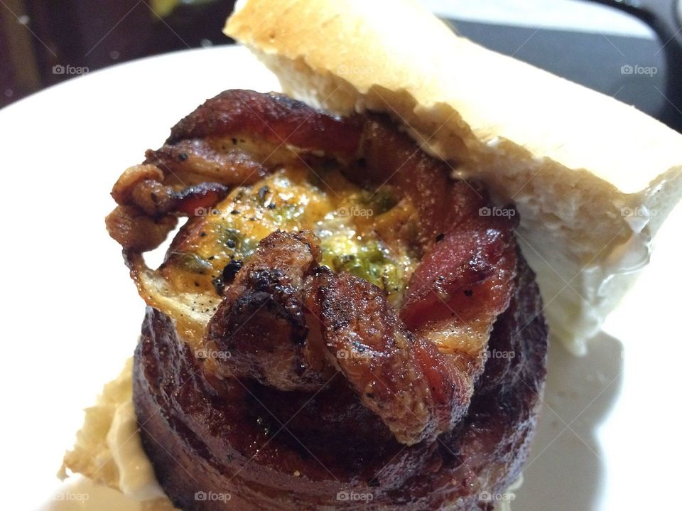 Hamburger with bacon cheese on a roll