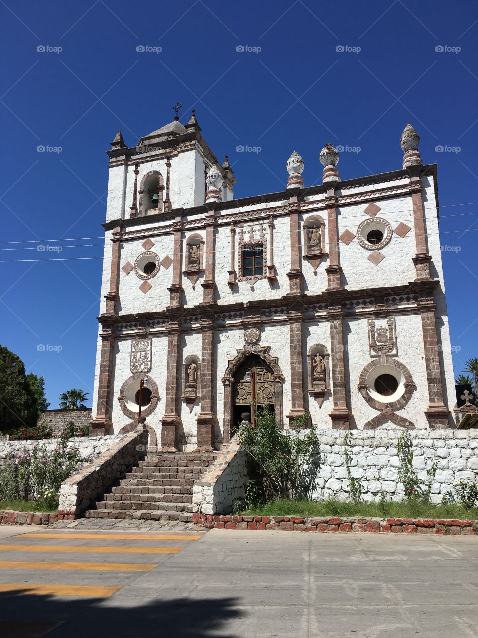 A beautiful old church in Mexico on a clear blue day. 