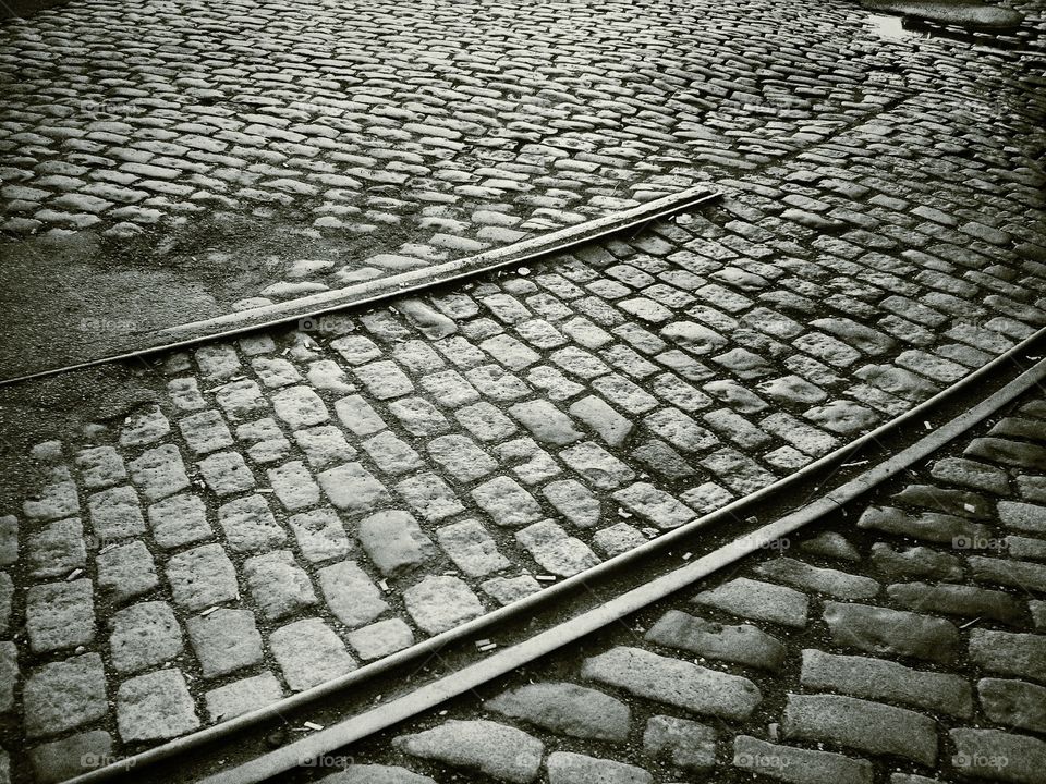 Abandoned Trolley Tracks in Cobble Stone Streets. Long abandoned tracks in Hoboken, NJ