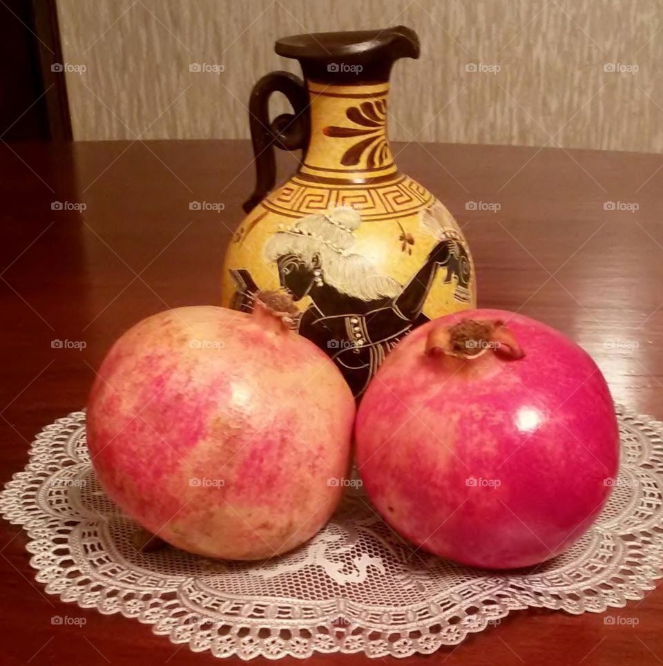 Ceramic jug for wine and pomegranates