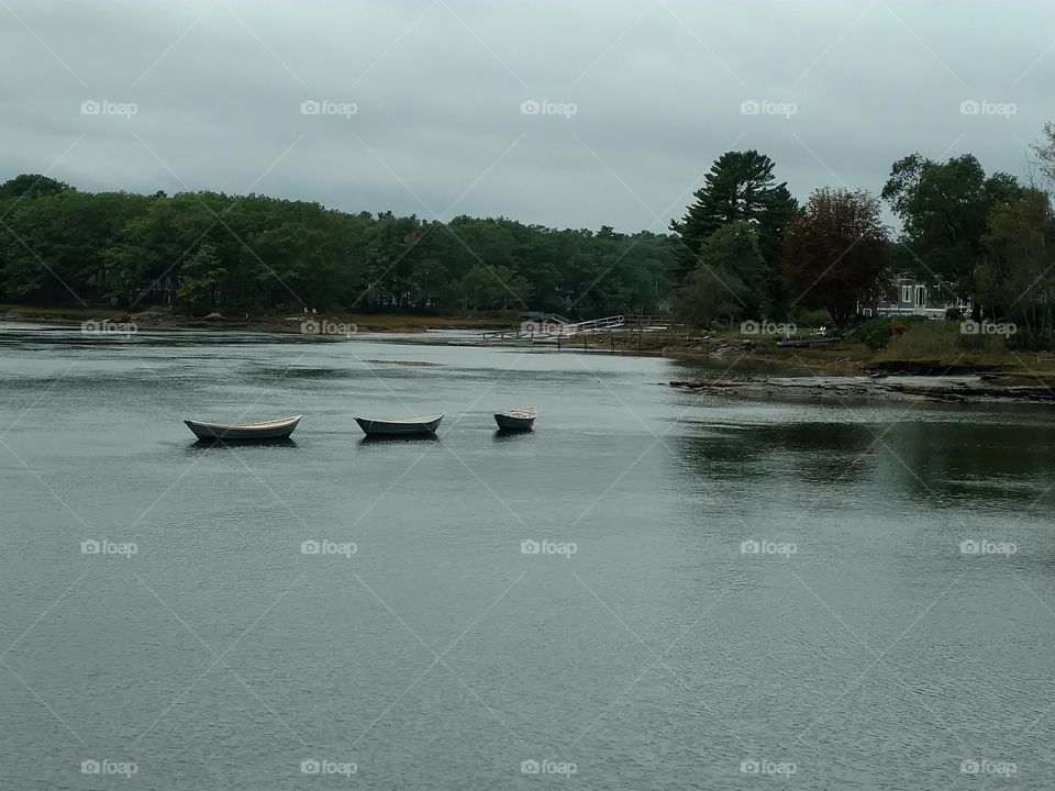 Wooden fishing boats in line