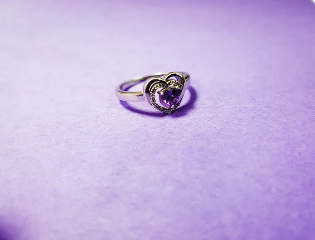 Wedding ring against purple background
