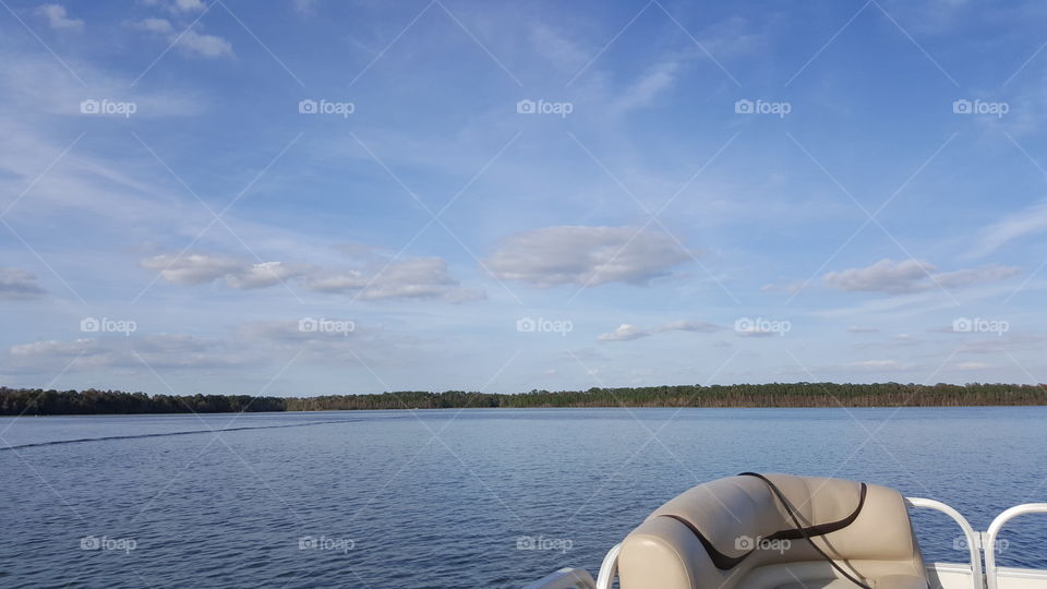 The skies are blue and the waters are calm on Bay Lake at the Walt Disney World Resort in Orlando, Florida.