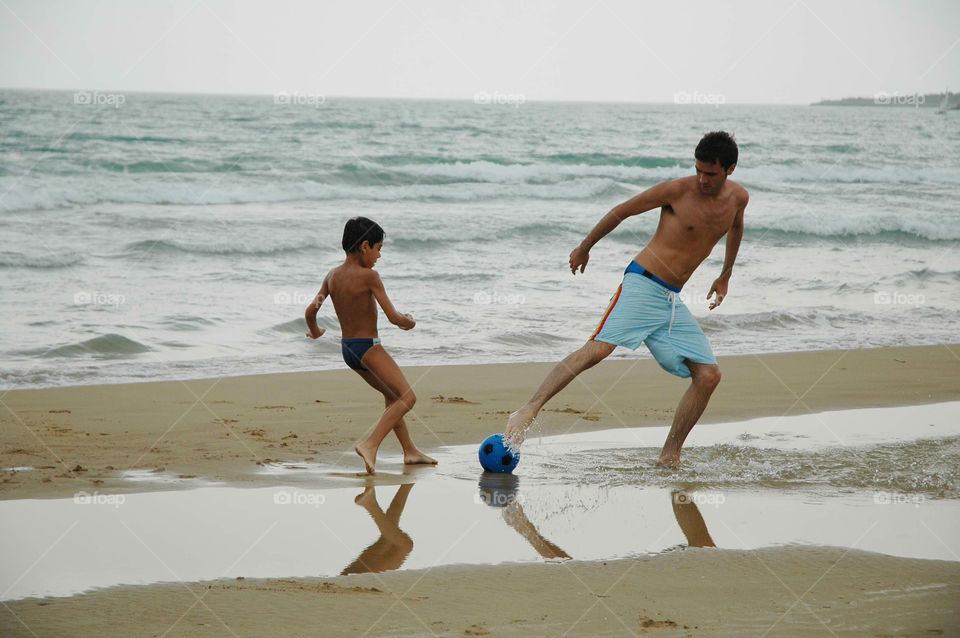 father and son on beach