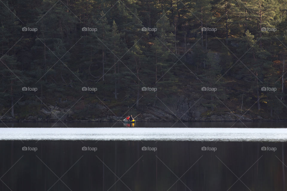 Fishermen in a boat on a calm lake