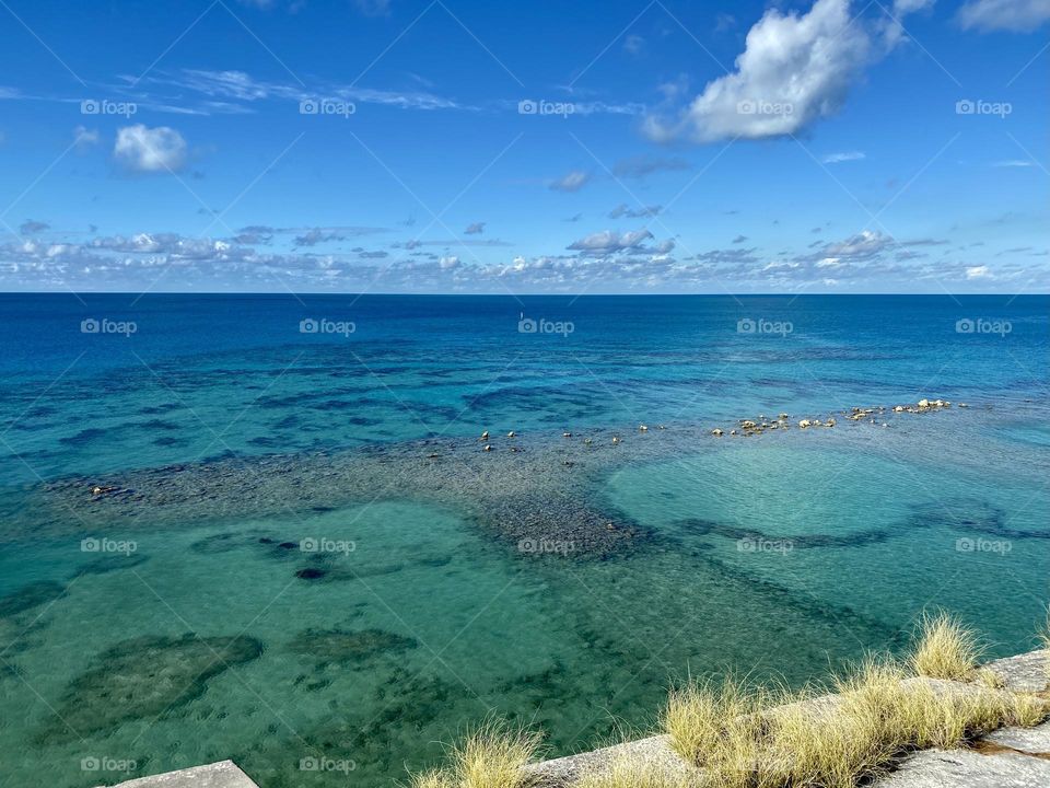 Blue and green water surrounding the island of Bermuda