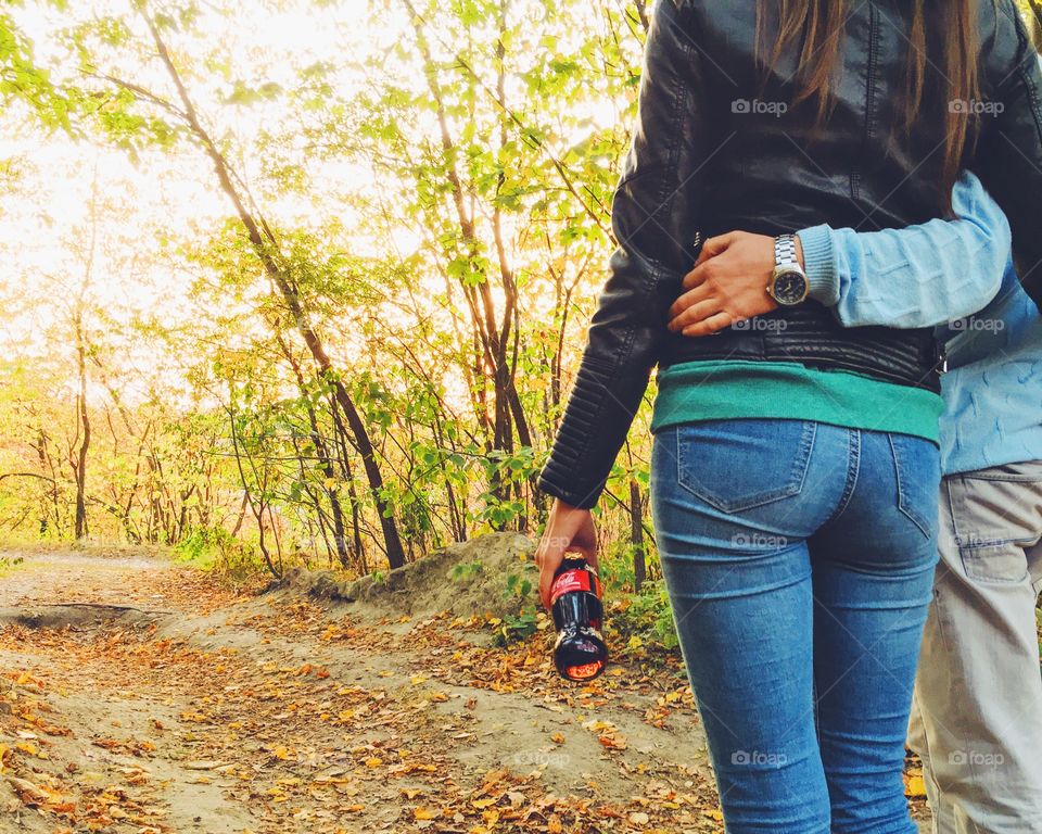 Couple in the forest with Coca Cola 