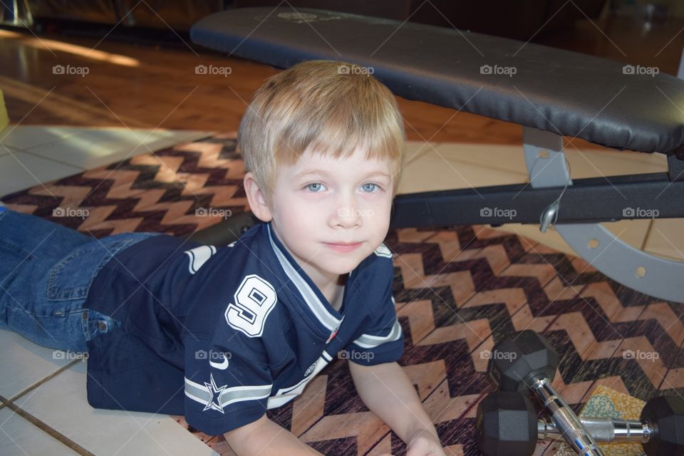 Boy laying on the floor