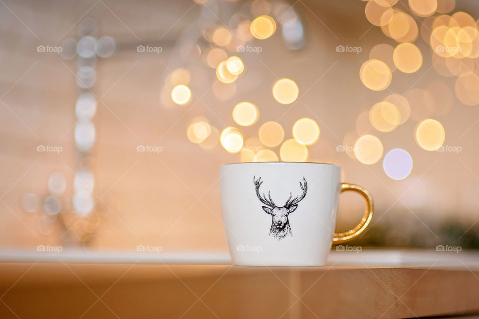 cup of coffee in a cozy festive Christmas atmosphere