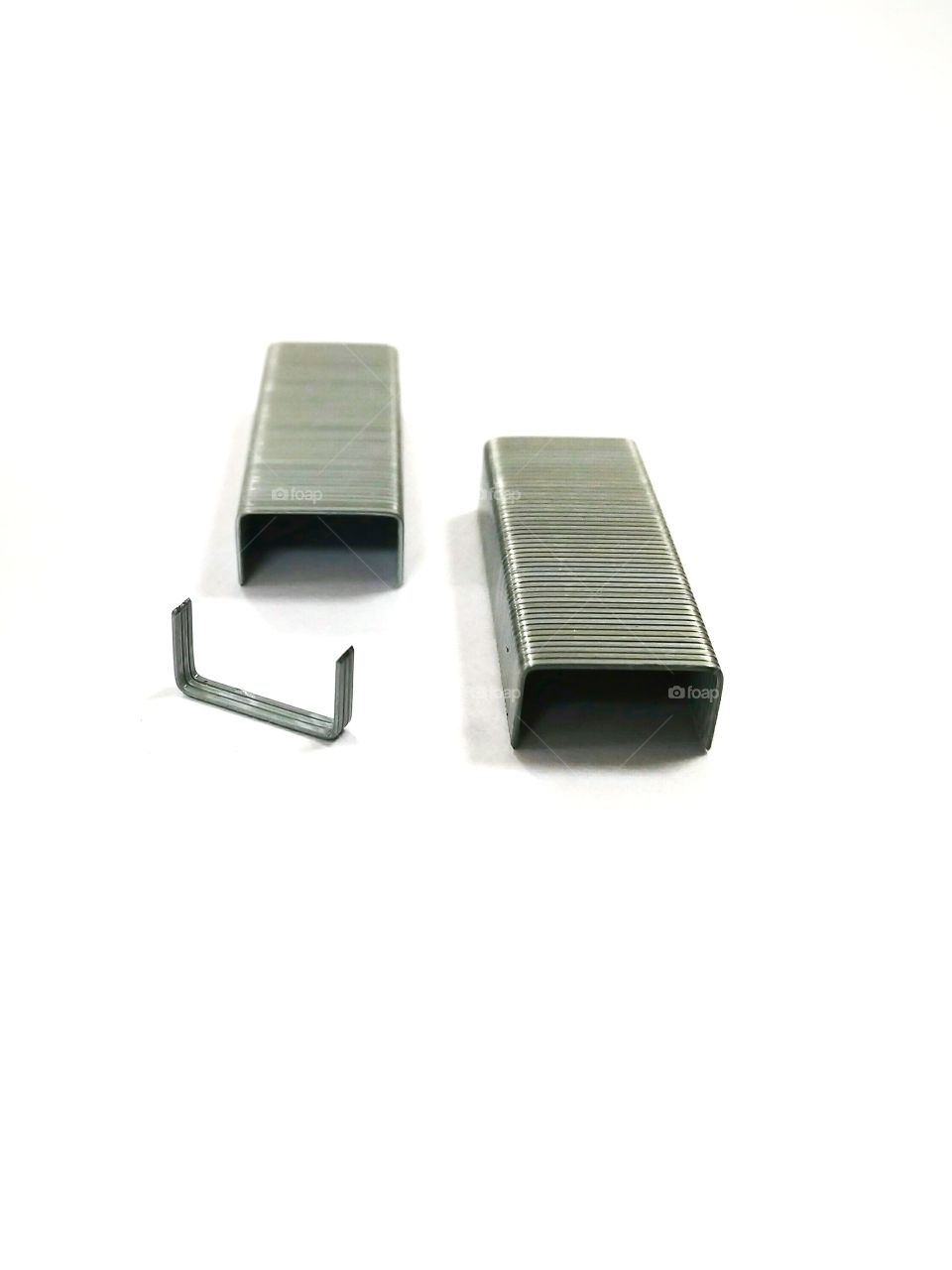 Steel staple pins on white background