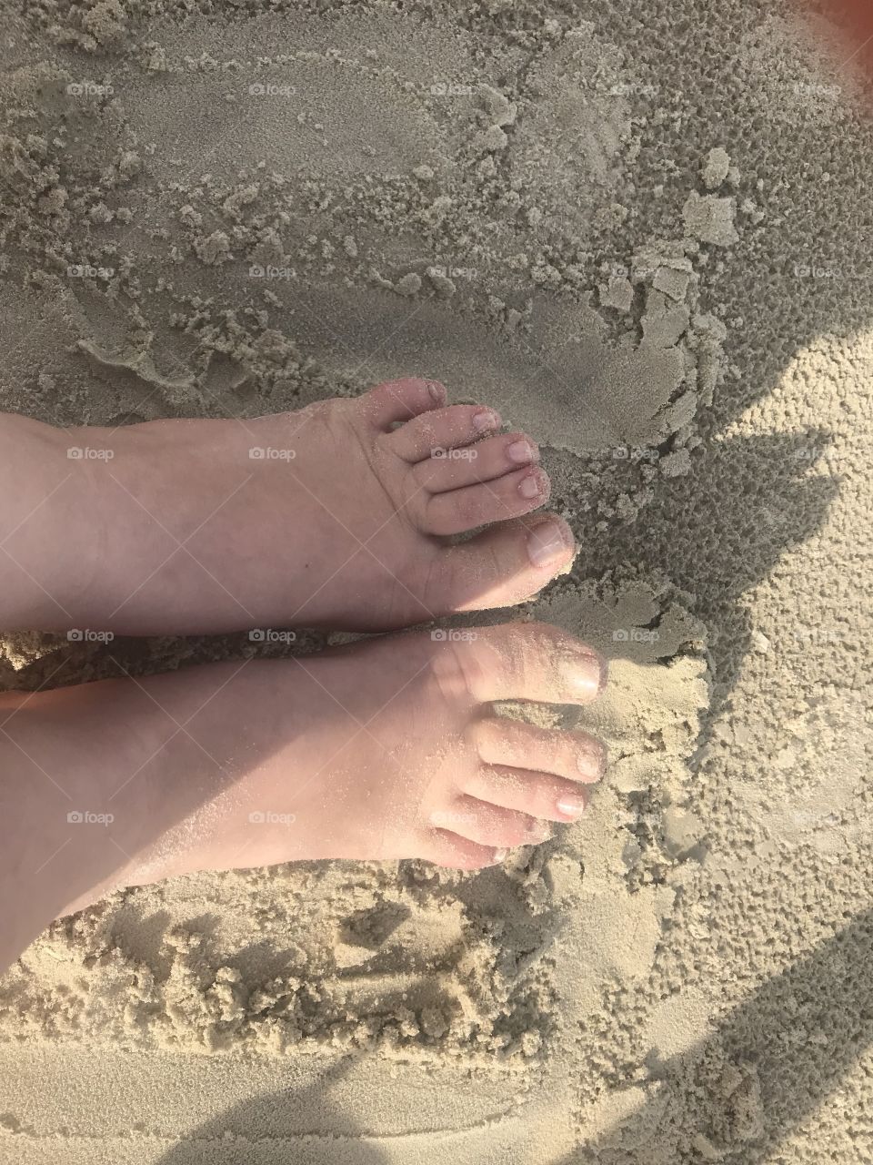 Pé na areia 