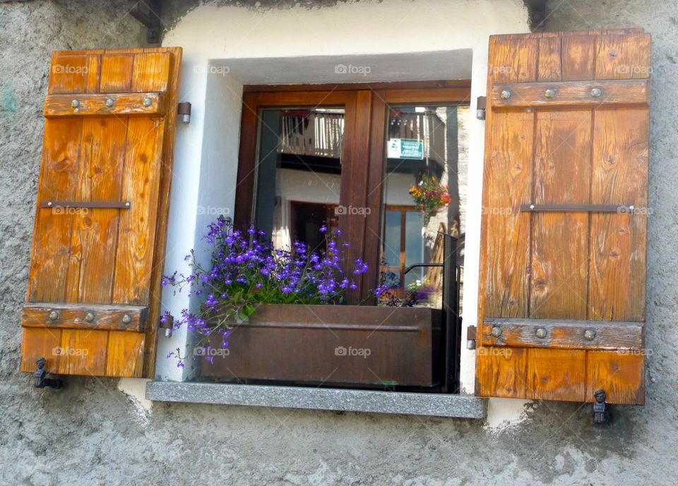 Window with wooden shutter