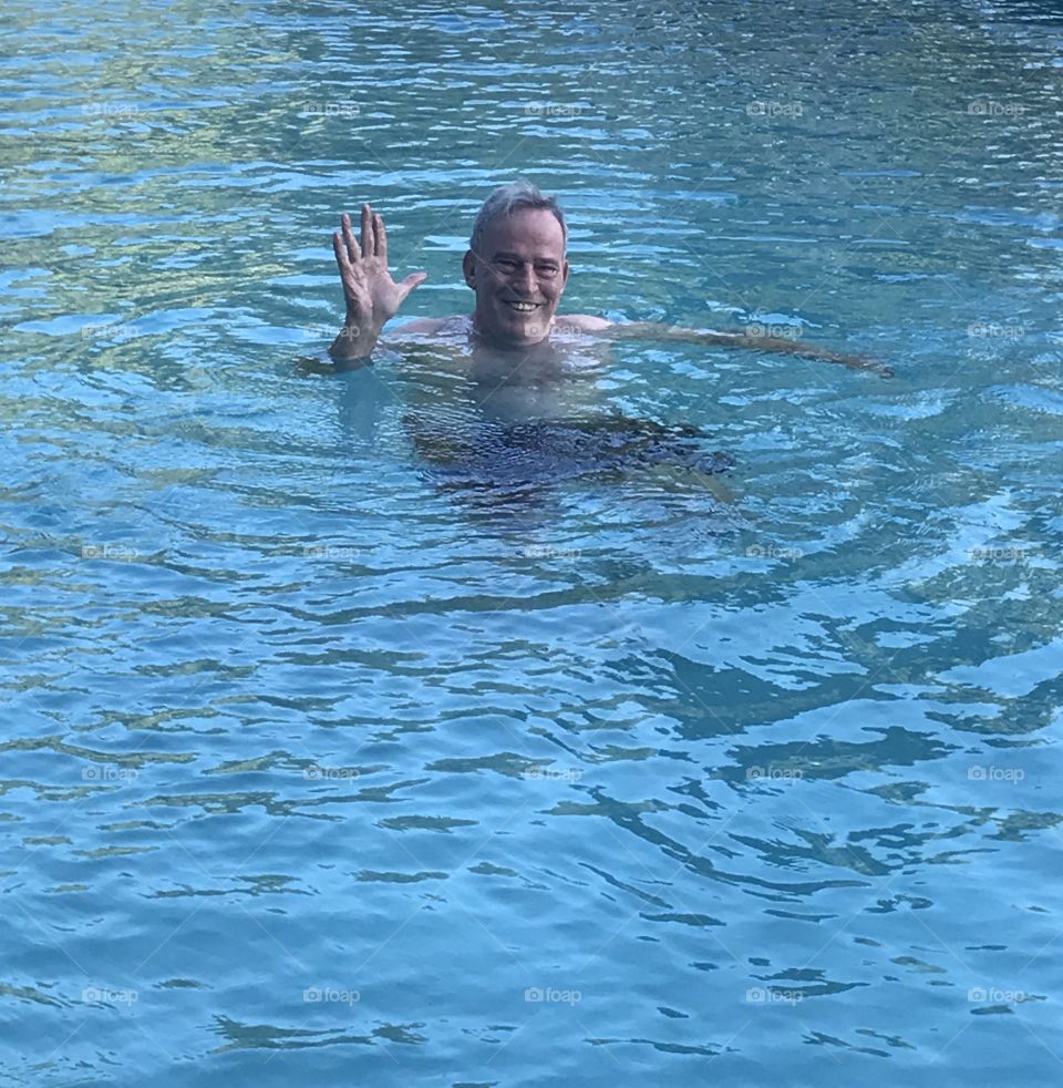 Handsome older gentleman in pool 