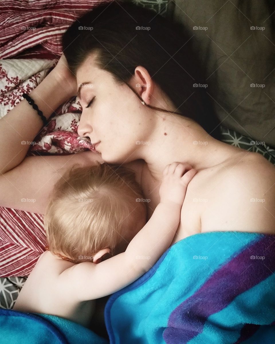 Complete bliss. A truly peaceful moment.... the embrace of a mother and child as they linger in that delicious space between wakefulness and sleep