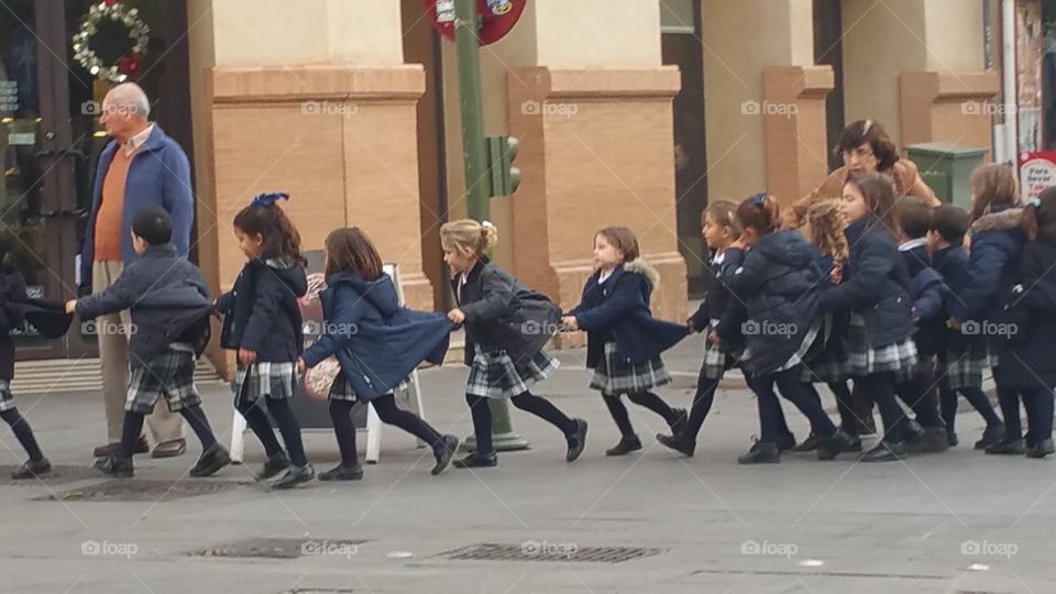 school children crossing the road