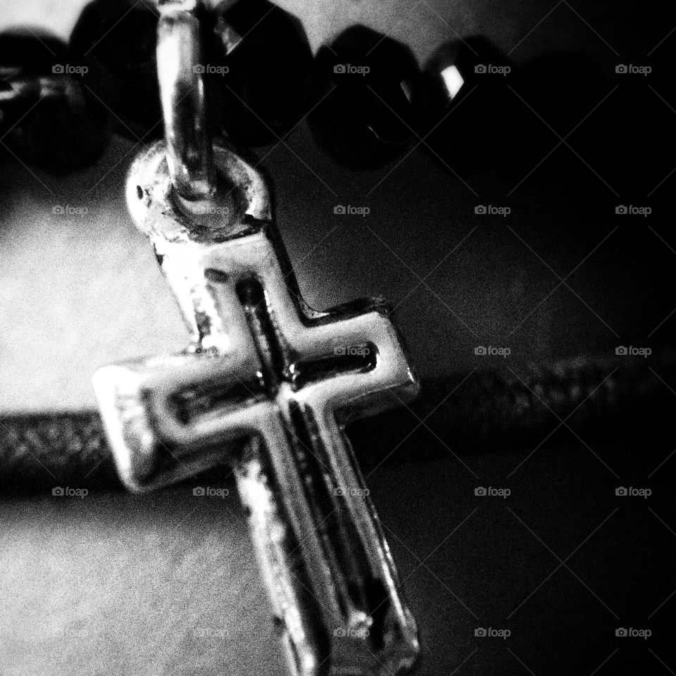 Close up of cross on bracelet