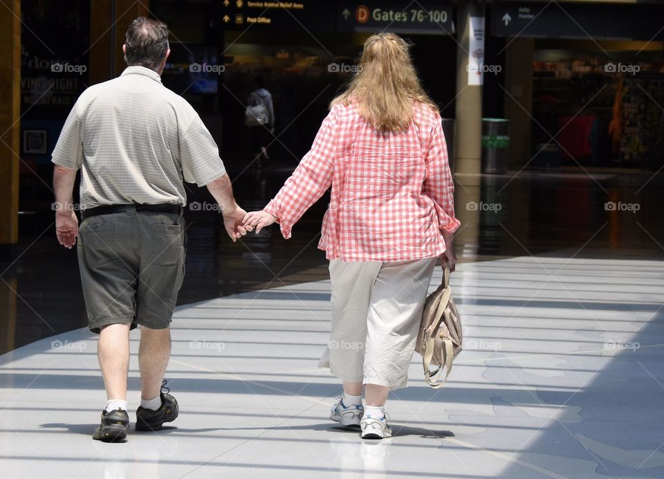 A couple walking in the airport