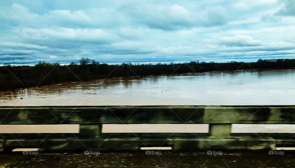 The mighty Red River rising on a soggy afternoon after days of rain in the region.