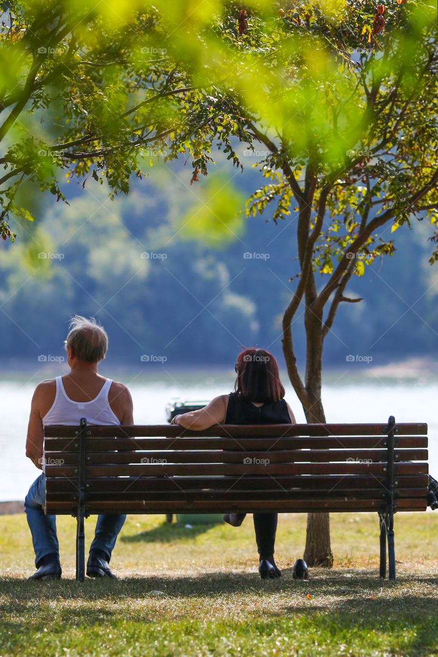 Elder couple enjoying river view