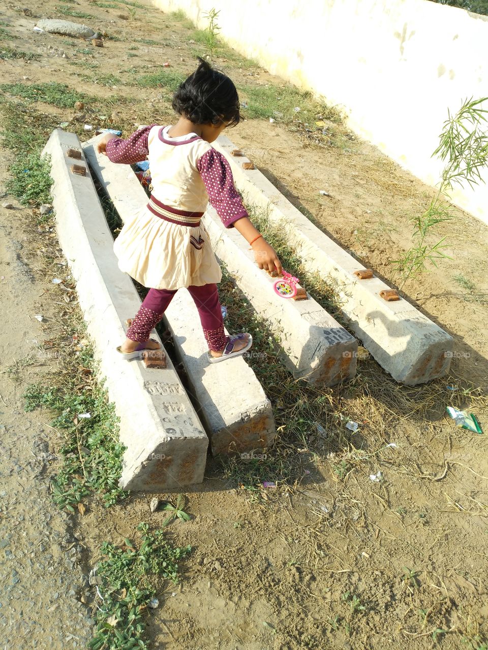 sitting idle , waiting for train . looking around .