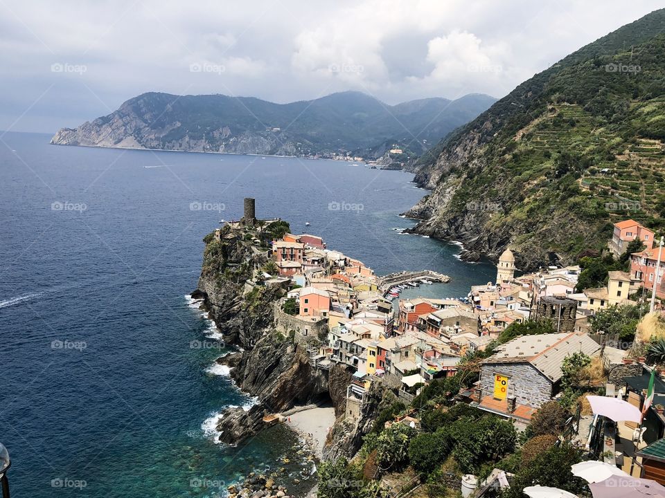 A breathtaking view from the edge of a cliffside hiking trail in Cinque Terra, Italy. 