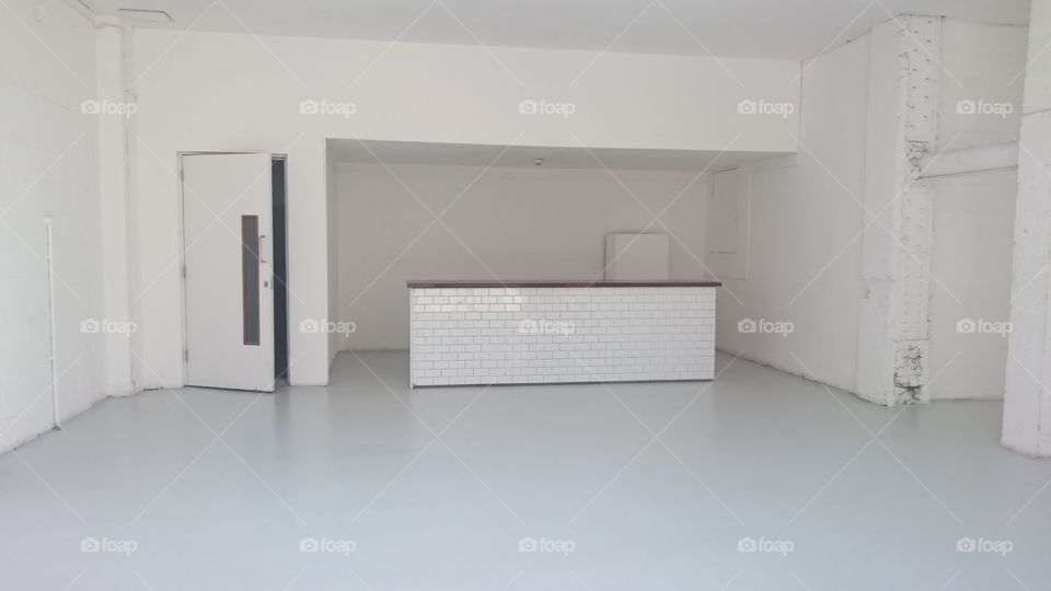 Commercial unit under refurbishment on Southampton Row, Bloomsbury, London. Light coloured decor. Observed midweek in Spring.